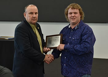 President Terry Wilkerson and outgoing Student Trustee Colt Henson